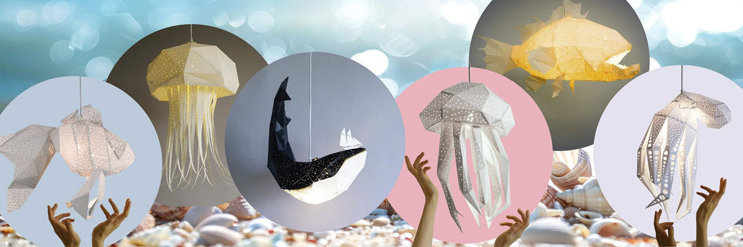 Lamps against coloured circles in a cloudy sky: a glowing yellow jellyfish, a black and white whale with a small sailboat on its back, dotted jellyfish, a yellow fish, and a hand reaching up towards them