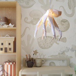 A child's room with Vasili Lights' Octopus Light hanging from a lamp.