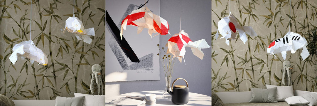 Handmade koi fish paper pendant lamp glowing warm over a table