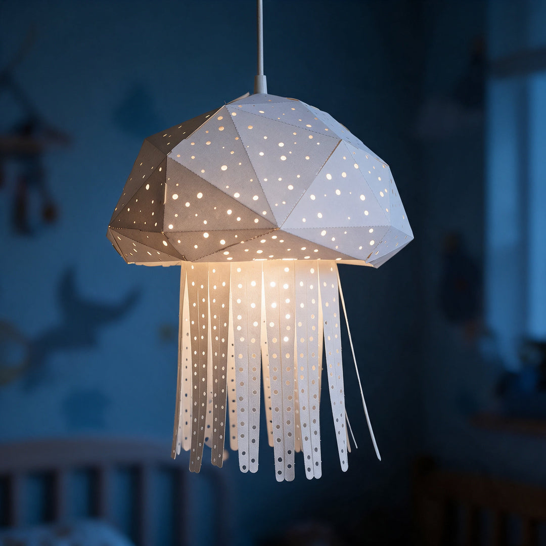 A lit White Baby Jelly Pendant Light in a blue nursery at night