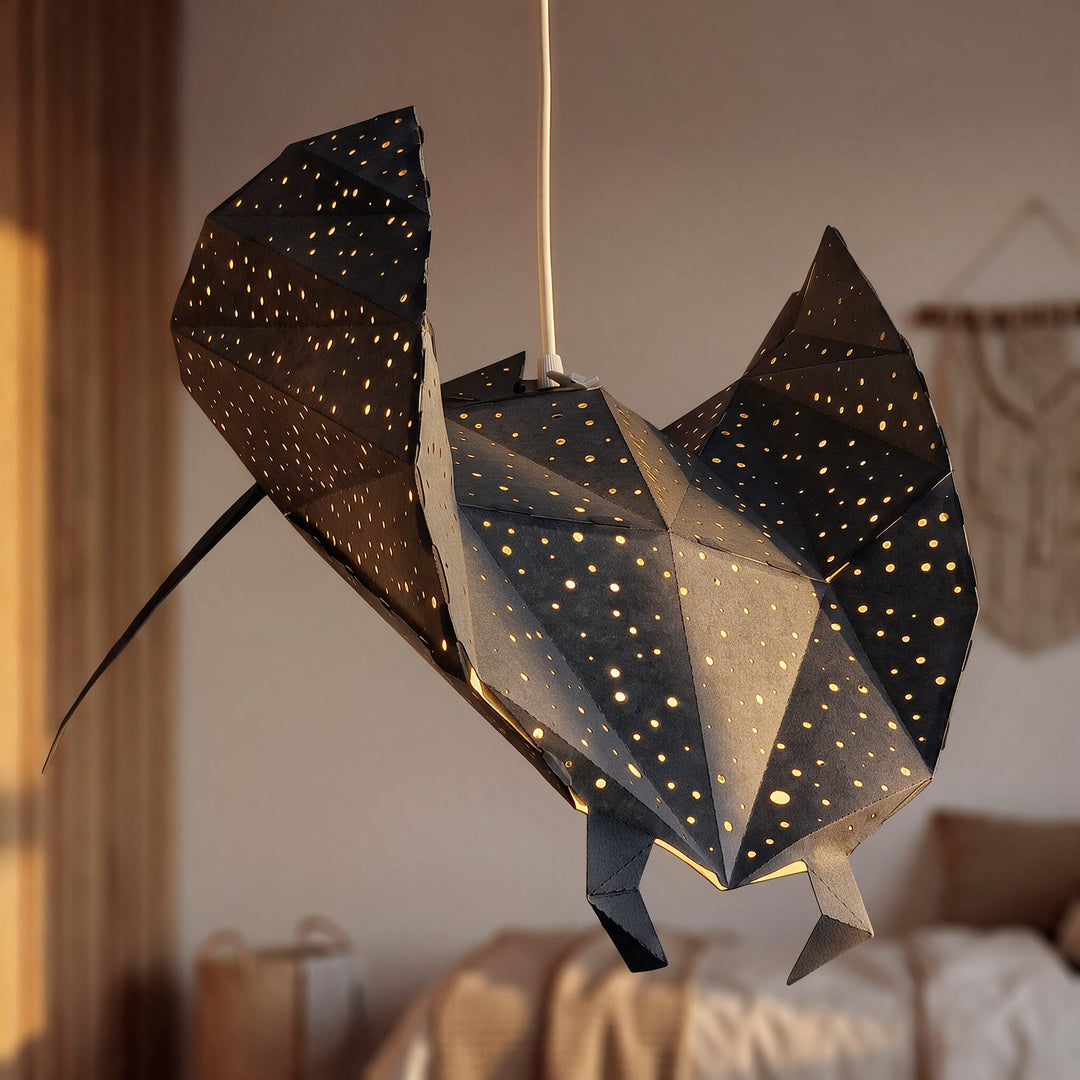 A Black Ray Origami Pendant Light in a sunlit bedroom