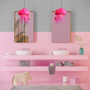 An pink bathroom with, featuring two sinks and two mirrors, adorned with the Baby Jelly Lamp, perfect for a bathroom.