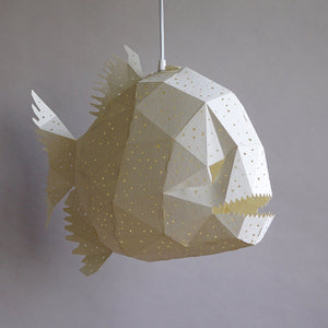 A Nautical Hanging Light Glowfish hanging from ceiling in a kids' room.