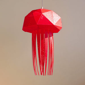 A red Nautical Ceiling Lamp Jellyfish shaped, hanging from a ceiling, creating a calming ambience for imaginative playtime.