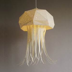 Nautical Hanging Jellyfish Light for a Child's Room or Nursery, inspired by origami art, delicately hanging from a ceiling.