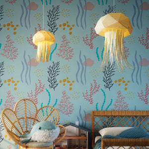 A child's bedroom or nursery with a Vasili Lights Nautical Jellyfish Lights hanging above the bed.